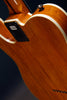 Calia: Badbone1, Korina, 9.5R Rosewood, Amber, Bound